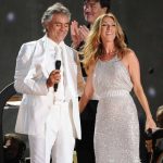 Andrea Bocelli, resplendent in a crisp white suit, awaits a special guest on stage. Suddenly, Celine Dion emerges in a sparkling silver dress. Together, they deliver a history-making rendition of “The Prayer,” now the most-watched version with over 198 million views.